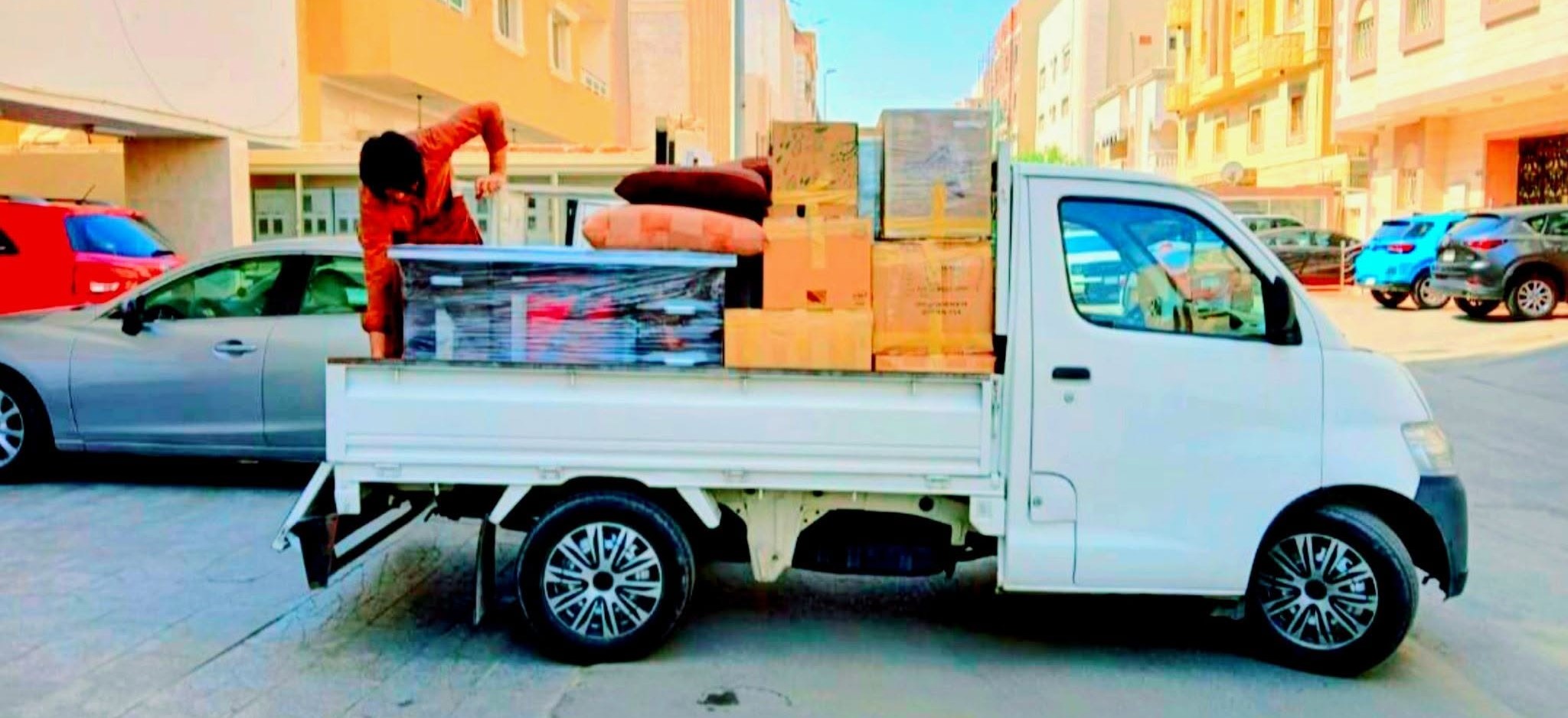 Professional moving team loading furniture onto truck